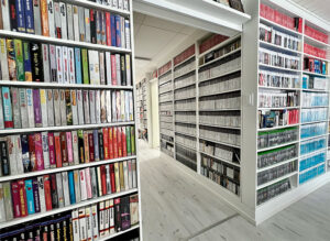 Book shelves full of retro games.